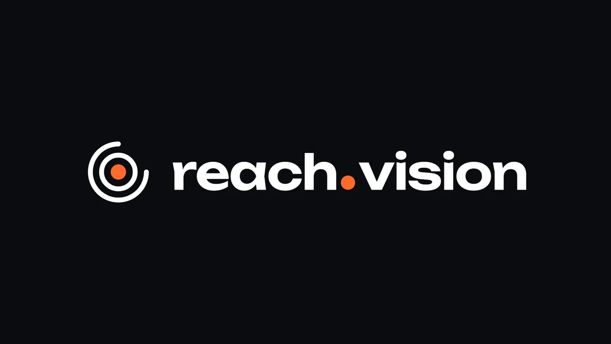 Reach Vision logo on a dark ink background